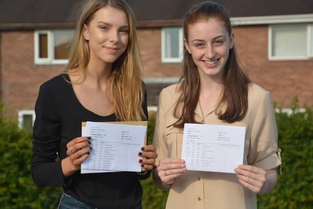 Chloe Catterall and Kelly Davies show off their results at Carr Hill High School