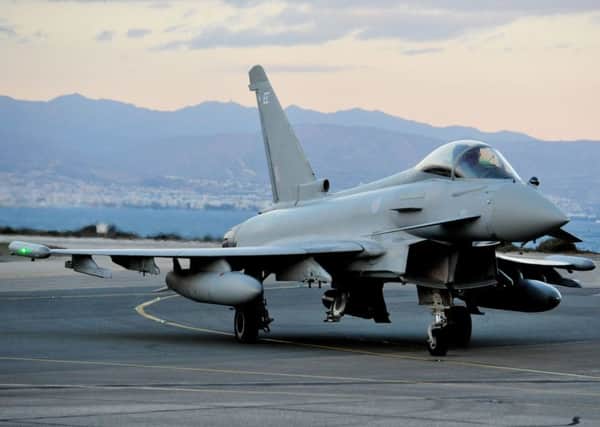 A RAF Eurofighter Typhoon arrives at RAF Akrotiri in Cyprus, to bolster the number of jets at the base which began the first British bombing runs over Syria. PRESS ASSOCIATION Photo. Picture date: Thursday December 3, 2015. The air strikes were carried out within hours of a vote by MPs in the Commons to back extending operations against Islamic State (IS) from neighbouring Iraq. Four RAF Tornado jets, which carry a range of munitions including Paveway IV guided bombs and precision-guided Brimstone missiles, took off from the Akrotiri base in Cyprus but defence officials refused to be drawn on the targets of their mission. See PA story POLITICS Syria. Photo credit should read: Nick Ansell/PA Wire