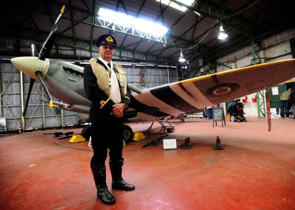 Volunteer Mark Gaskell with one of the Spitfires  at Lytham St Annes Spitfire Museum, Blackpool Airport
