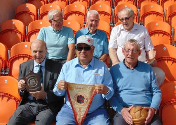 Former Blackpool FC player Cheung Chi Doy, front centre, reunites with his former team mates, from left, Graham Oates, Tommy Thompson, Barrie Martin, Jimmy Armfield and Glyn James.