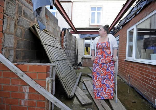 Gemma Greenhalgh and the unfinished building work at her home