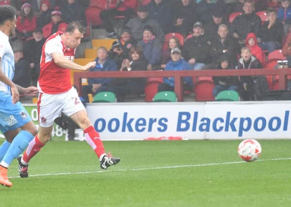 Fleetwood Town's Martyn Woolford, pictured in action against Coventry, was brought off early against Blackpool due to a head injury