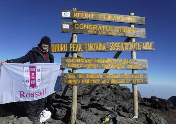 Jonathan Chard on top of Mount Kilimanjaro