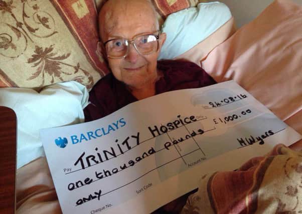 The late Harry Wyers with a cheue for Trinity Hospice