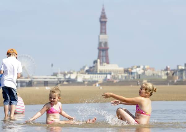 Taylor Stanfield-Lees, three, and Brooke Stanfield-Lees, seven, play in the water on South Shore beach during a previous heatwave.