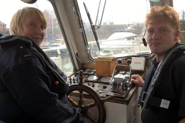 Wendy Coleman and Graeme  Hall, founder members of the Fleetwood MVS unit in the wheel house of the group's vessel, Curlew.