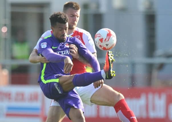 Fleetwood Town's Ashley Eastham battles with Charlton Athletic's Nicky Ajose