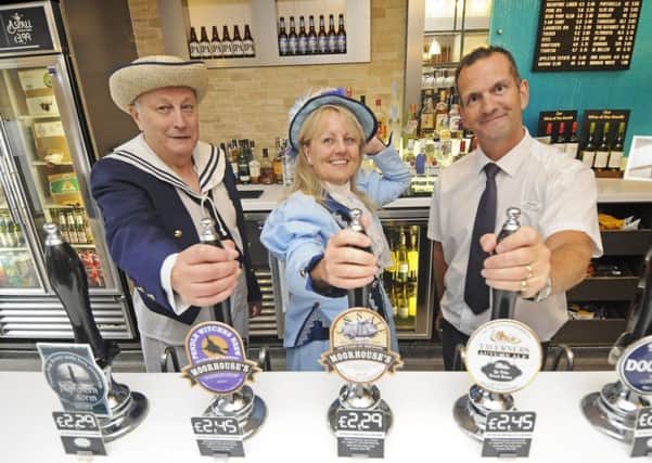 Marton Operatic Society is staging two of its productions in mock pubs with props being provided by Wetherspoons pub The Railway Hotel.  Pictured are Tony Alman and Lynn Corlett with Railway manager John Fothergill.