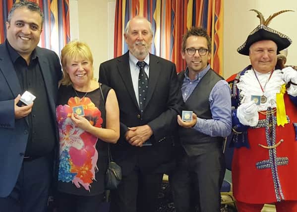 Veli Kirk, chef-proprietor of Anatolia Turkish restaurant and deputy chairman of St  Annes Enterprise Partnership, Bev Sykes of Just Good Friends, Digby Moulden from Lytham St Annes RNLI, Mark Daniels from The Stage Company and Colin Ballard, town crier for Lytham St Annes, with Queen's 90th birthday medals presented by St Annes town mayor Coun Cheryl Little