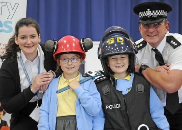 Marine engineer Emily Fowles and Chief Inspector Lee Wilson with pupils Abigail Veevers and John McPhearson, both aged 7, at the Primary Futures Event