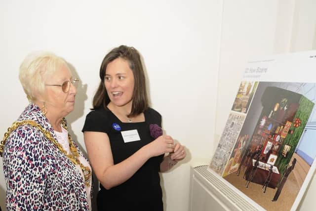 Drop-in event for the Blackpool Museum project at St John's Parish Church.  Curator Emma Heslewood talks to mayor Kath Rowson.