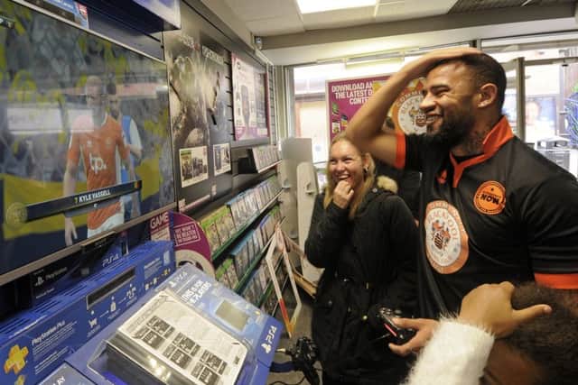 Blackpool FC players at GAME playing FIFA 2017. Kyle Vassell is sent off.