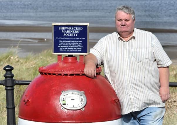 Picture by Julian Brown 25/09/16


Frank Pook, the Fleetwood agent for the Shipwrecked Mariners Society, pictured next to the red sea mine which is now a collection point for the charity which thieves keep targeting.
