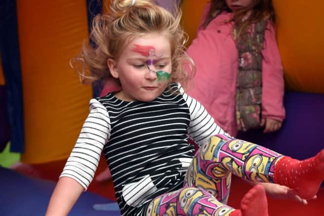 Pictures Martin Bostock. The reopening of Freckleton Memorial Park.  4 year old Olivia McGinty having fun on the bouncy castle
