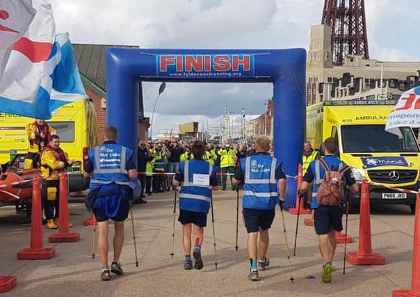 Dan Farnworth, paramedic, Rich Morton, paramedic lecturer, Gill Despard and senior paramedic, Phil Baggaley complete their Scarborough to Blackpool Blue Light walk for charity.