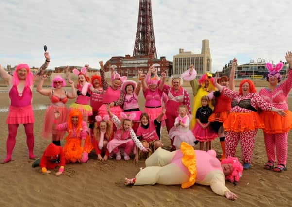 Photo Neil Cross
Staff from Cancer Research UK shops taking part in the annual pink dip