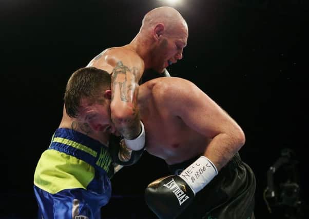 Scott Cardle gets in a tangle with Kevin Hooper in Glasgow