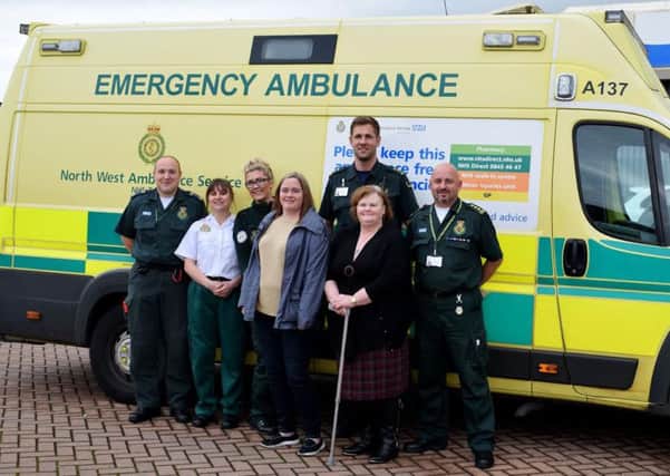 Cardiac arrest survivor Jennifer Lawrence has been reunited with some of the ambulance crew that helped to save her life.