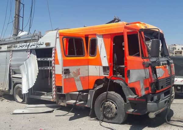 The White Helmets, a group of volunteer firefighters in Syria, said four people were hurt when this engine was caught up in a bomb attack in Haritan