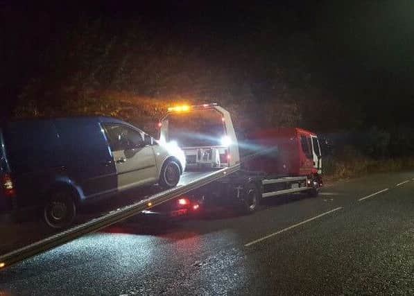 The VW Caddy was towed away after a package containing drugs and cash amongst other things was found by police