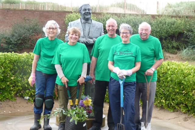 St Annes In Bloom chairman Fiona Boismaison with fellow committee members (from left) Monica Pople,  Ian Roberts, Gillian Robinson and Tony Ford working on the area surrounding the Les Dawson statue