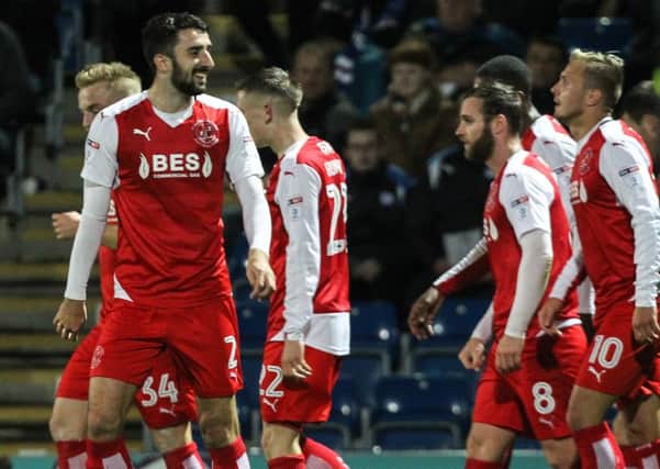 Fleetwood Town's Conor McLaughlin celebrates opening the scoring with his team mates at the Proact Stadium