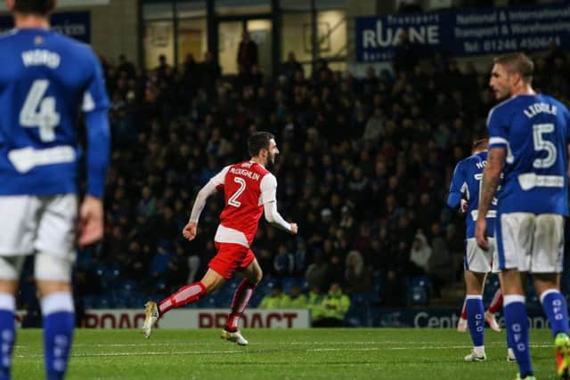Fleetwood Town's Conor McLaughlin wheels away in celebration after opening the scoring