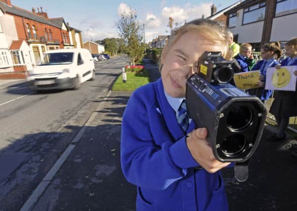 Pupils from Staining Primary School help take part in a speed awareness campaign with PCSOs on Chain Lane.  Pictured is Sophie Horsfall, aged 10.