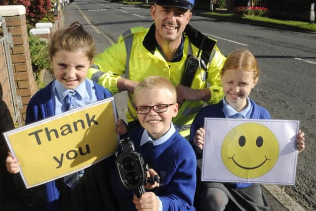 Pupils from Staining Primary School help take part in a speed awareness campaign with PCSOs on Chain Lane.  Pictured is PCSO Trevor Sterling with pupils Amelie Pellowe, 10, Ryan Hurren and Emily Harrison, both aged 9.