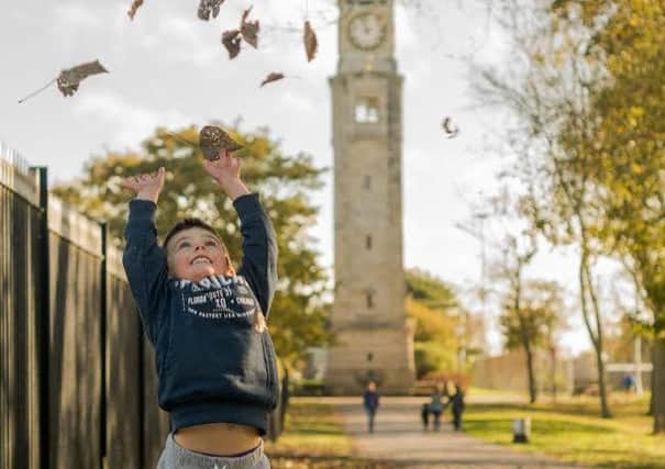 Four-year-old Decster Holmes from Blackpool enjoying an autumnal Stanley Park