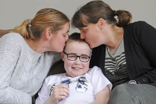 11-year-old Ollie Alderson is back home after spending 10 months in hospital.   He is pictured with auntie Kath Thomas and mum Anne.