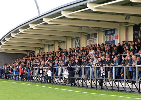 The packed east stand at AFC Fylde Picture: STEVE MCLELLAN