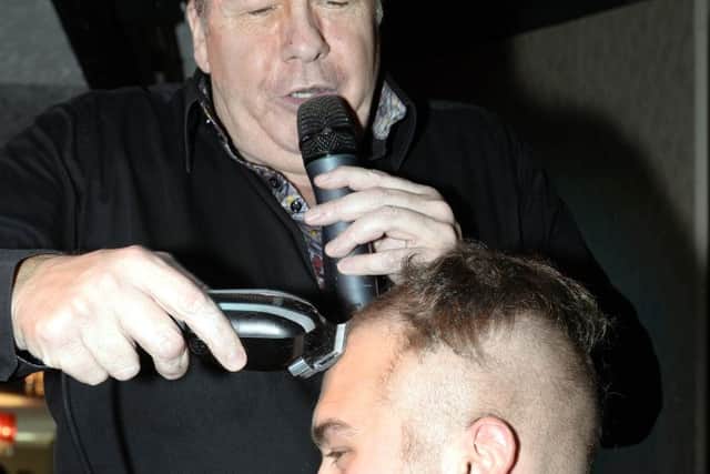 Comedian Joey Blower has raised almost £150,000 fopr Cancer Charities by shaving audience members' hair on stage at the Merrie England Bar, North Pier.
Joey Shaves the head of Chris Rickett.