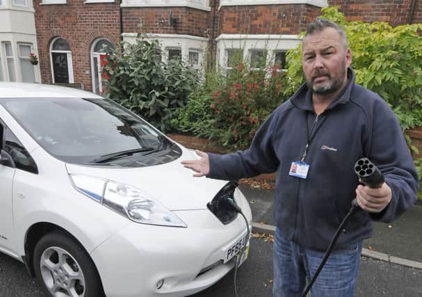 Taxi driver Simon Sharples has no where to charge his electric car