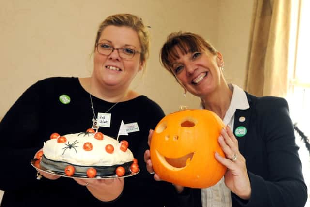 From left, Claire Ainsworth and Marie Thomas Staff, volunteers and residents at the Halloween charity cake off