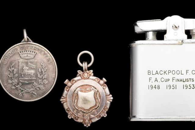 The  medals and engraved lighter