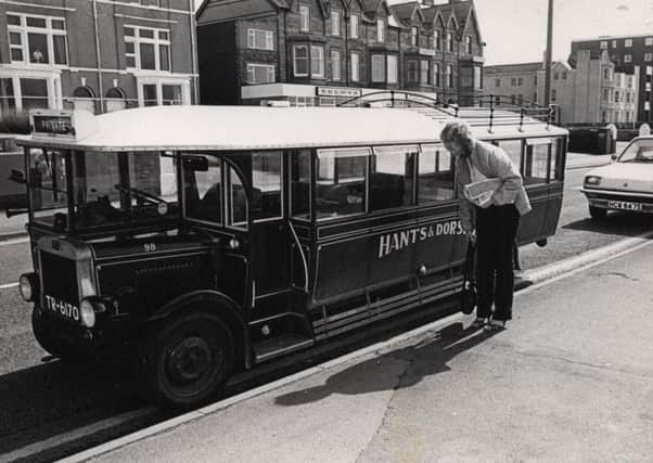 Passer-by Linda Firth takes a closer look at this replica bus in St Annes in April 1983