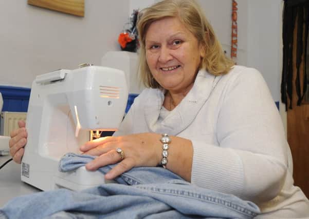 Claremont First Step Community Centre in Blackpool hosts a regular sewing group as part of the council's adult learning programme.
Cathy Adams on the sewing machine.  PIC BY ROB LOCK
27-10-2016