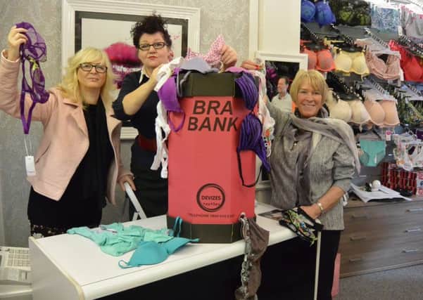 Tracey Griffin (Left), Isabel Wilkie (centre) and Sharon Griffin, at the Lingerine Lounge on Queen Street, with the bra bank