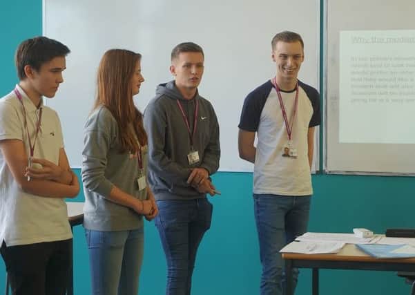 Blackpool Sixth Students pitching their ideas to Bryan Lindop. L-R: Calum Young, Erin Menzies, Liam McClean and Michael Hill.