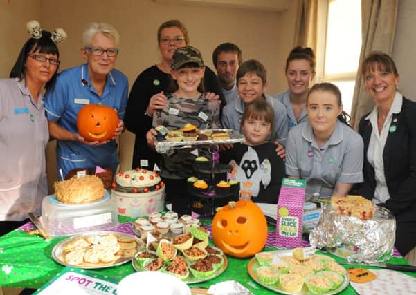 Staff, volunteers and residents at the Halloween charity cake off, raising funds for the Macmillan Cancer charity at The Manse Nursing Home, Kirkham.