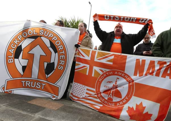Blackpool fans protest against the club owners outside the ground ahead of kick-off on Sunday