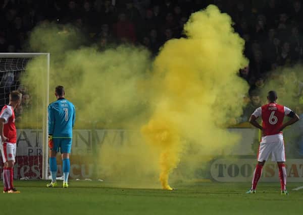 The game is stopped for a flare on the pitch

Photographer Dave Howarth/CameraSport

The Emirates FA Cup First Round - Southport v Fleetwood Town - Monday 7th November 2016 - Merseyrail Community Stadium - Southport 
 
World Copyright Â© 2016 CameraSport. All rights reserved. 43 Linden Ave. Countesthorpe. Leicester. England. LE8 5PG - Tel: +44 (0) 116 277 4147 - admin@camerasport.com - www.camerasport.com