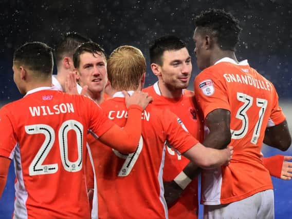Blackpool players celebrate Gnanduillet's goal