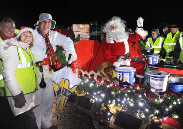 Fleetwood Rotary Club guided Santa and his sleigh through Broadwater and Flakefleet raising funds for Christmas food hampers for the needy.
The team prepare to set off.  PIC BY ROB LOCK
8-12-2015