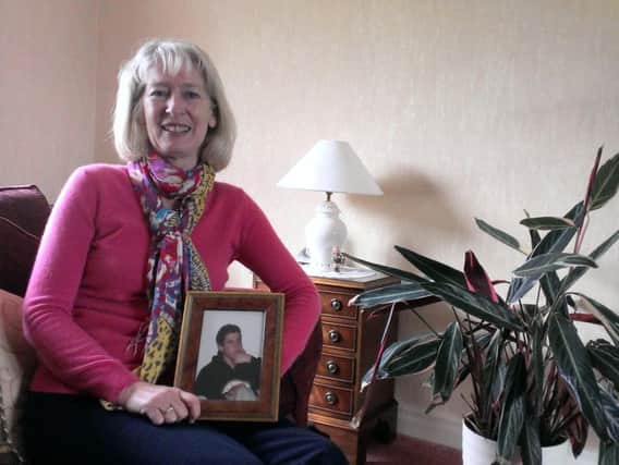 Ruth Lowe with a photo of her son Andrew Parr