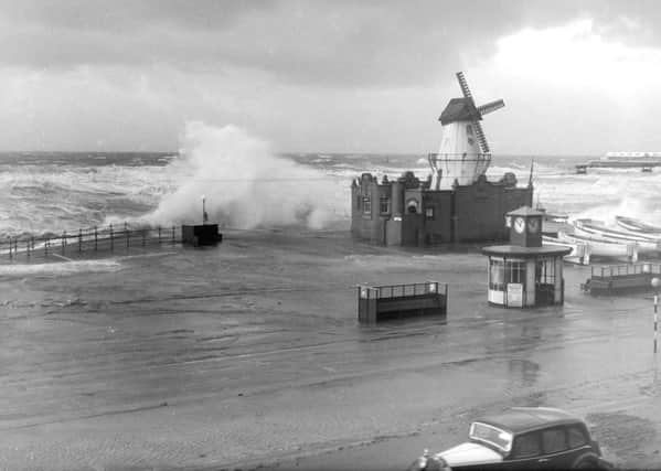 The windmill between South Pier and Central Pier ( close to the Manchester Hotel) is battered by the stormy sea in 1951 historical