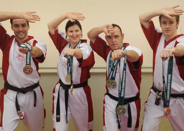 Blackpool Karate now have two world champions, as well as two bronze medallists from the World Championships recently held in Dublin.
Pic L-R: Matthew Walker, Patricia Noble, Paul Robinson (the two gold medallists) and Dale Noble.  PIC BY ROB LOCK
15-11-2016
