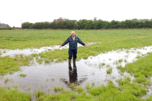Lytham farmer Andrew Pemberton in one of his flooded pastures