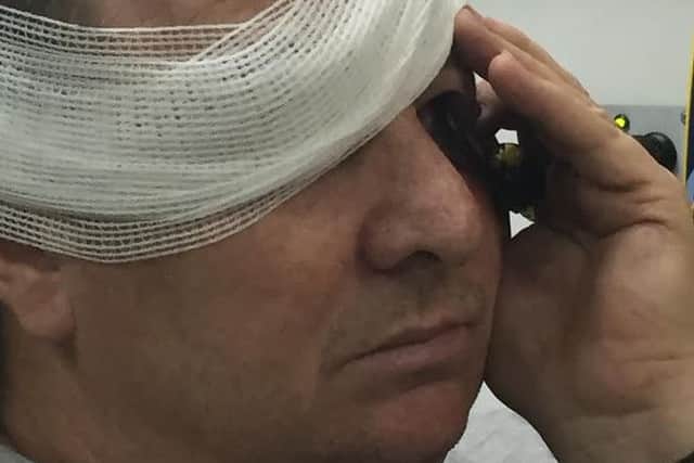 Roy Alexander in the back of an ambulance after impaling his eye with an elasticated bungee cord hook